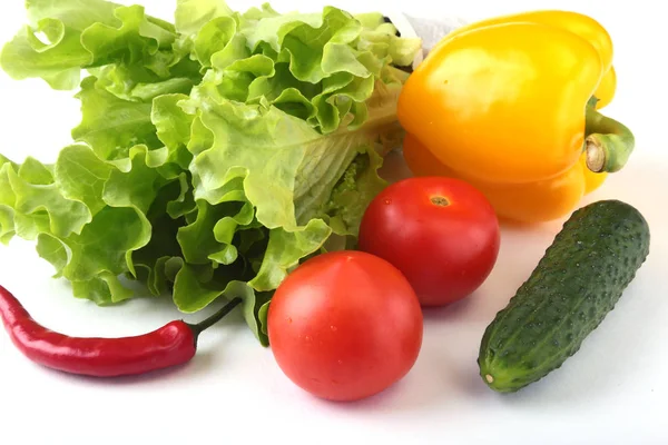 Assorted vegetables, fresh bell pepper, tomato, chilli pepper, cucumber and lettuce isolated on white background. Selective focus. — Stock Photo, Image