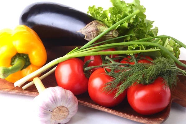 Fresh assorted vegetables, eggplant, bell pepper, tomato, garlic with leaf lettuce. Isolated on white background. Selective focus. — Stock Photo, Image