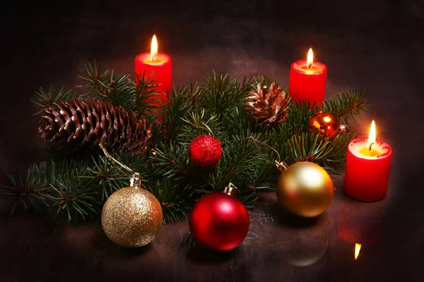 Christmas decoration with colorful balls, candles and christmas tree on a wooden desktop. — Stock Photo, Image