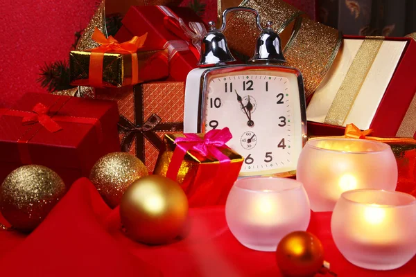 Christmas clock and candles. New Years Decoration with gift boxes, christmas balls and tree. Celebration Concept for New Year. — Stock Photo, Image