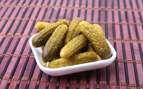 Pickles. Bowl of pickled gherkins cucumber with copy space. Cornichons. — Stock Photo, Image
