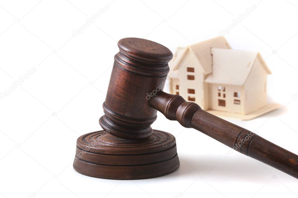 House Auction, auction hammer , symbol of authority and Miniature house . Courtroom concept.