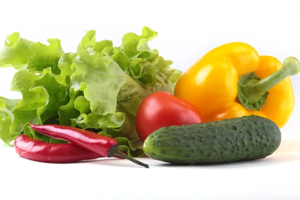 Assorted vegetables, fresh bell pepper, tomato, chilli pepper, cucumber and lettuce isolated on white background. Selective focus. — Stock Photo, Image