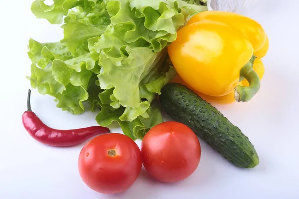 Assorted vegetables, fresh bell pepper, tomato, chilli pepper, cucumber and lettuce isolated on white background. Selective focus. — Stock Photo, Image