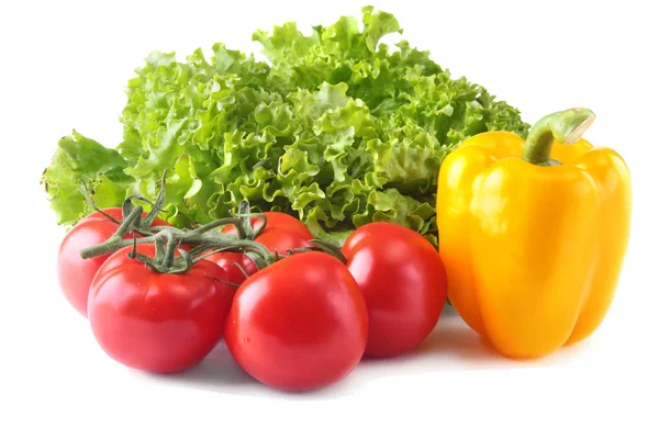 Fresh assorted vegetables bell pepper, tomato, garlic with leaf lettuce. Isolated on white background. Selective focus. — Stock Photo, Image