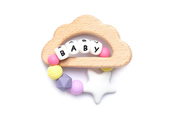 Bebé juguete de madera y teethers colores pastel sobre fondo blanco — Foto de Stock