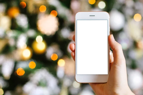 Cep telefonu ve Noel ağacı süslemesi. Pembe ve altın toplarla klasik ve lüks renklerde. Mutlu yıllar ve Xmas teması