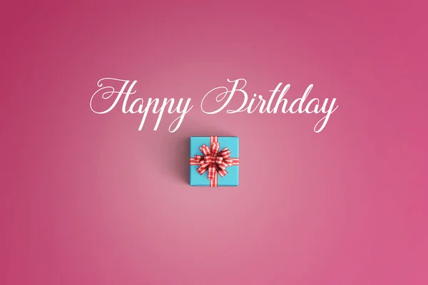 Happy birthday and gift box on color background — Stock Photo, Image