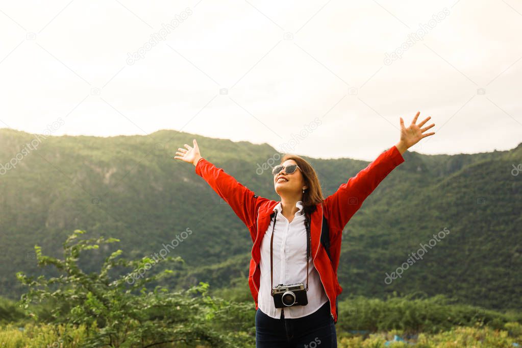 Young Asian woman in red choth travel in the mountain with vinta