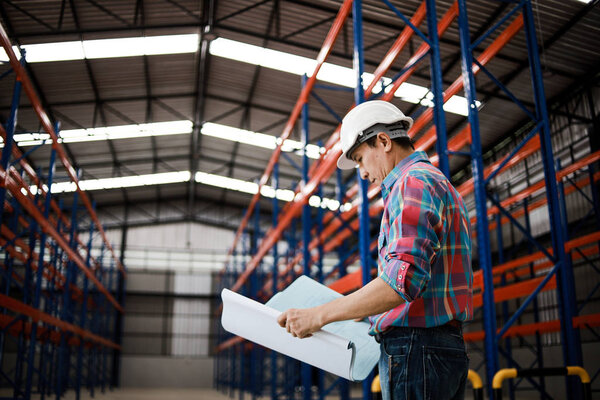 Asian Engineer man working in building factory 