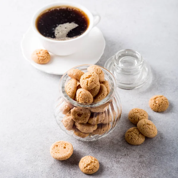 Amaretti cookies with white cup of coffee — Stock Photo, Image
