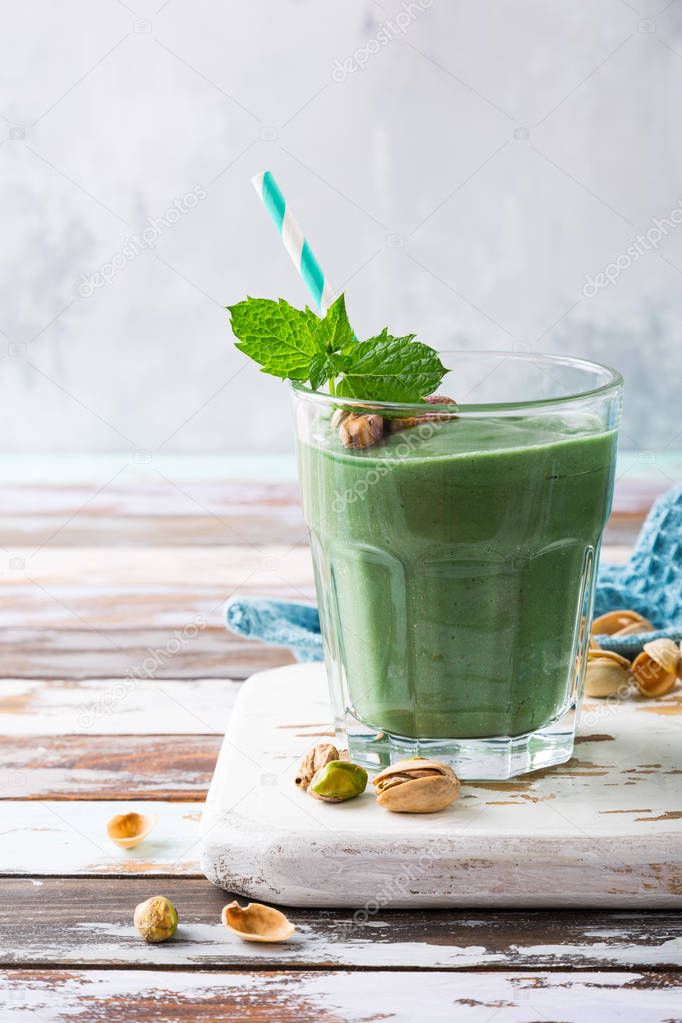 Healthy green smoothie with mint and pistachios
