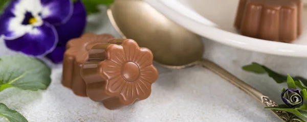 Chocolate candies in flower shape — Stock Photo, Image