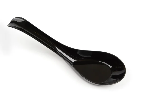 Black plastic spoon — Stock Photo, Image