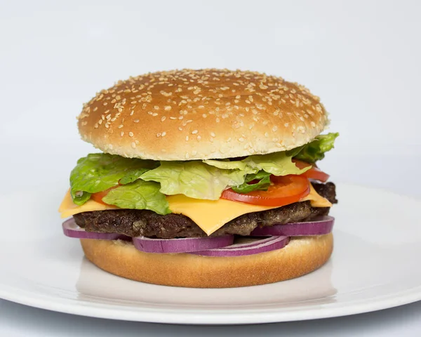 American cuisine. Fast food. Burger on a white background. Cheeseburger. Menu