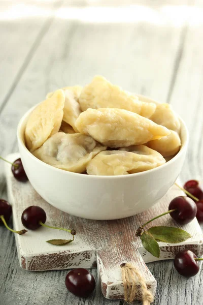 Concept Ukrainian Cuisine Dumplings Cherry Light Wooden Background Background Image — Stock Photo, Image