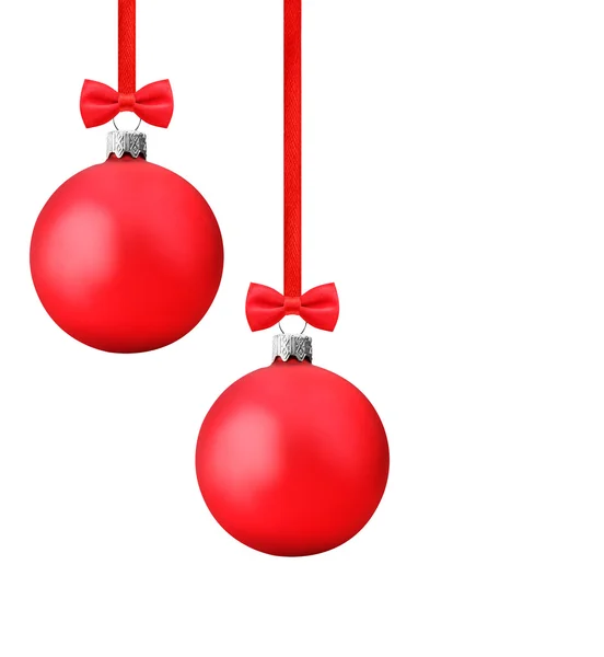 Red christmas balls with bow hanging on a red ribbon clipping path — Stock Photo, Image