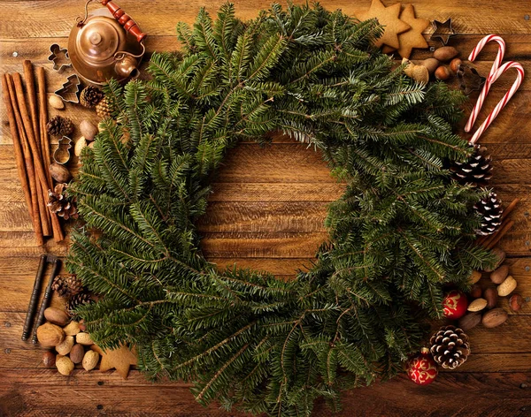 Christmas pine wreath with spices and candy cones — Stock Photo, Image