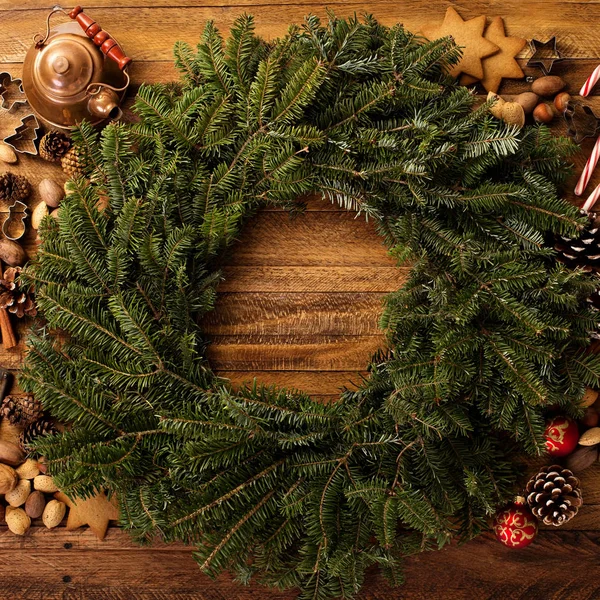 Christmas pine wreath with spices and candy cones — Stock Photo, Image