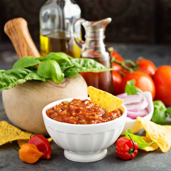 Homemade spicy tomato salsa with vegetables and olive oil — Stock Photo, Image