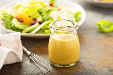 Homemade honey mustard salad dressing clipart