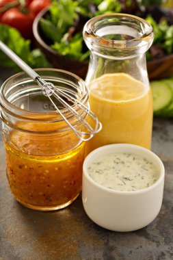 Variety of sauces and salad dressings clipart