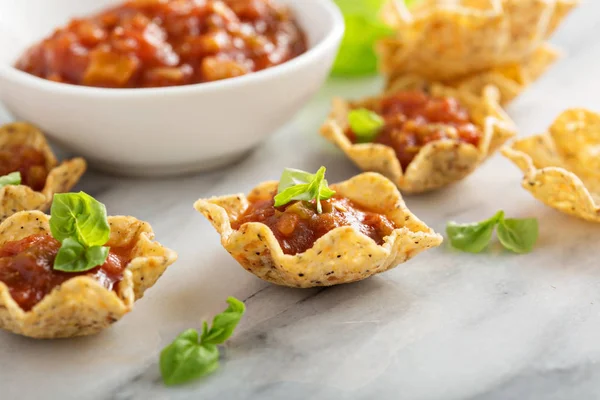 Small mexican style appetizers made with tortilla bowls