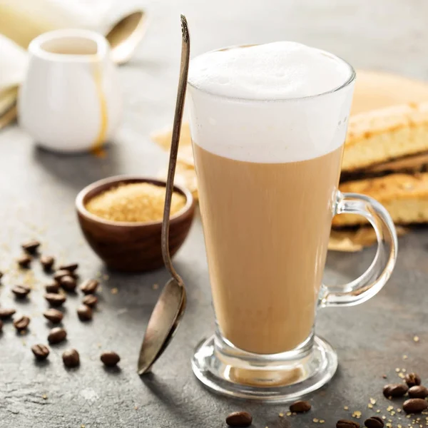 Hot coffee latte with biscotti cookies — Stock Photo, Image