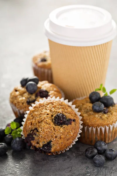 Vegan banana blueberry muffins with coffee to go — Stock Photo, Image