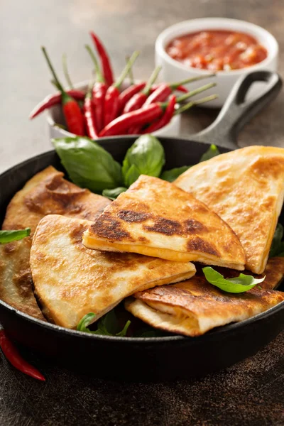 Cheese quesadillas in a cast iron pan — Stock Photo, Image