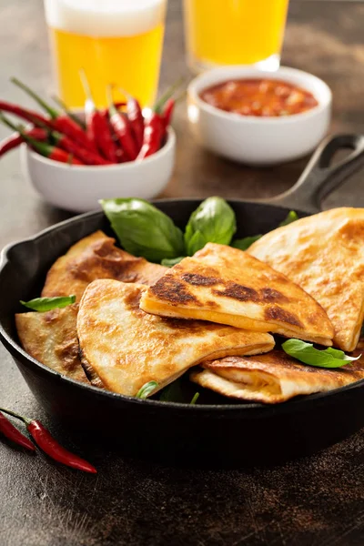 Cheese quesadillas in a cast iron pan — Stock Photo, Image