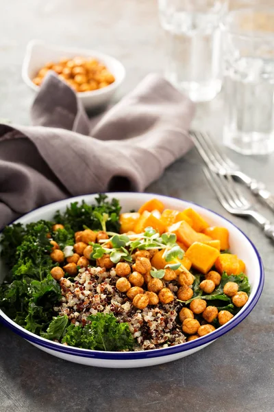 Green and healthy grain bowl with roasted chickpeas