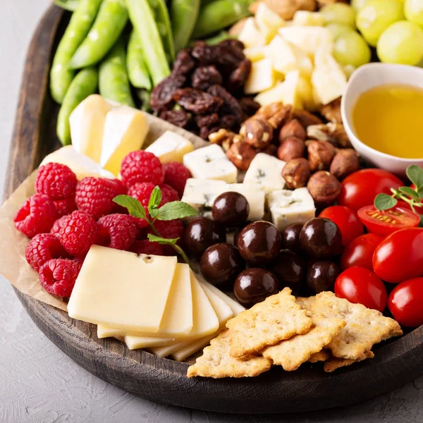 Cheese plate with fresh vegetables and fruits — Stock Photo, Image