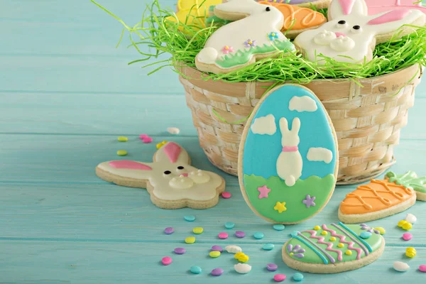 Easter cookies on blue table — Stock Photo, Image