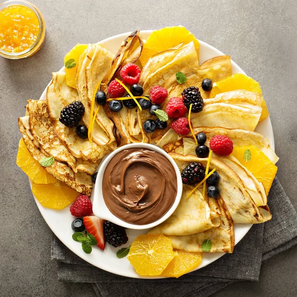 Thin crepes with fresh fruit and berries — Stock Photo, Image
