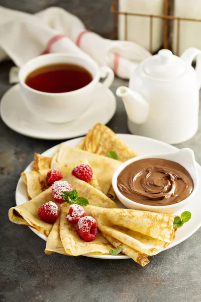 Crepes with raspberry and chocolate sauce — Stock Photo, Image