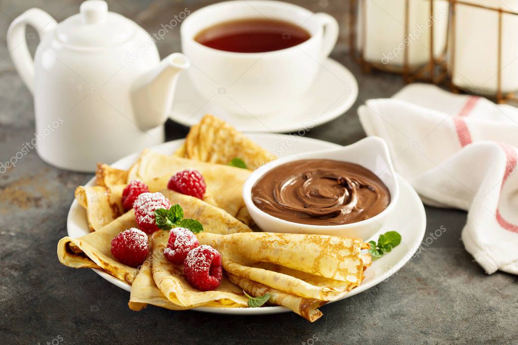 Crepes with raspberry and chocolate sauce