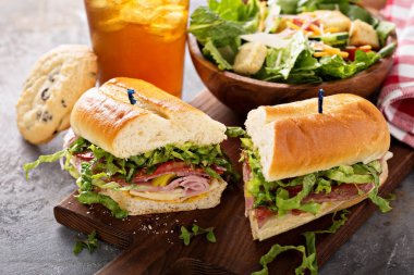 Italian sub sandwich with chips clipart