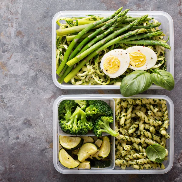 Vegetarian meal prep containers with pasta and vegetables