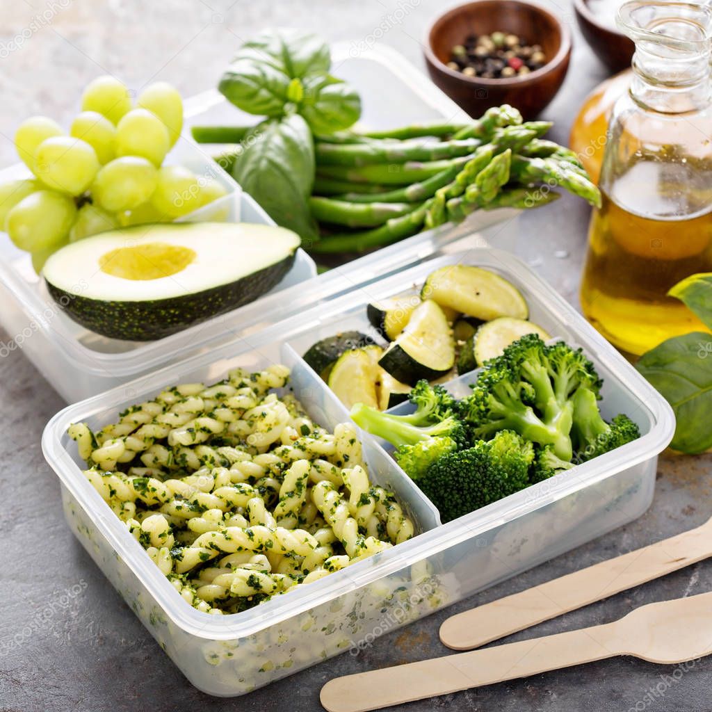 Vegan meal prep containers with pasta and vegetables