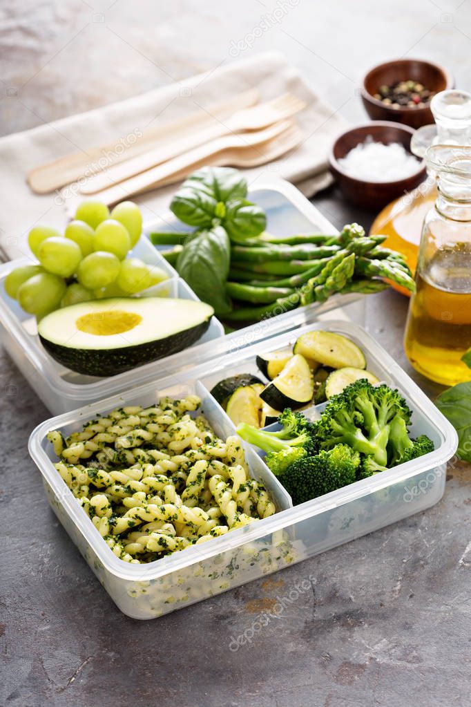 Vegan meal prep containers with pasta and vegetables