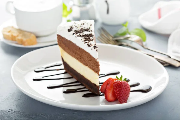 Three chocolate layered mousse cake — Stock Photo, Image