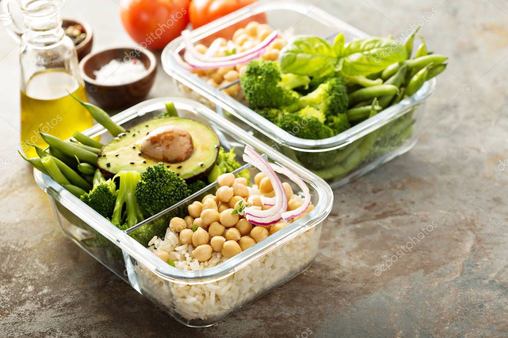 Vegan meal prep containers with cooked rice and chickpeas