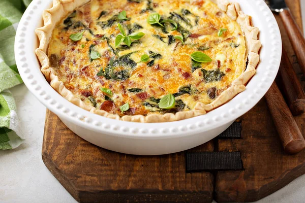 Homemade quiche with bacon and spinach — Stock Photo, Image