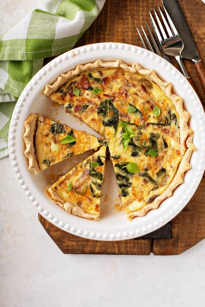 Homemade quiche with bacon and spinach — Stock Photo, Image