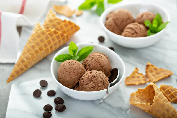 Chocolate ice cream scoops in a white bowl — Stock Photo, Image
