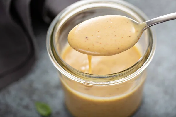 Homemade honey mustard sauce in a glass jar — Stock Photo, Image