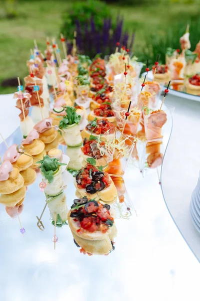 Beautifully decorated catering banquet table with different food — Stock Photo, Image