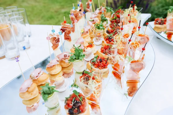 Beautifully decorated catering banquet table with different food — Stock Photo, Image