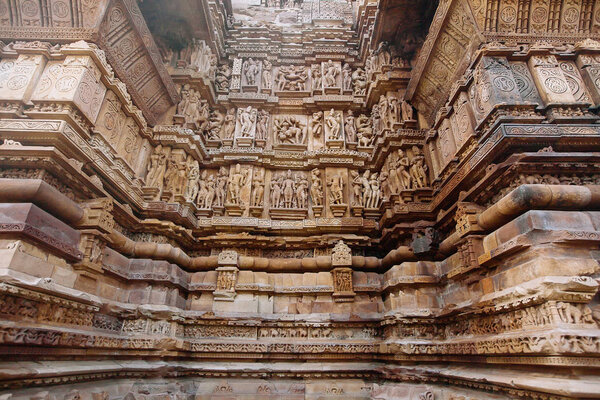 Ancient bas-relief at famous erotic temple in Khajuraho, India.